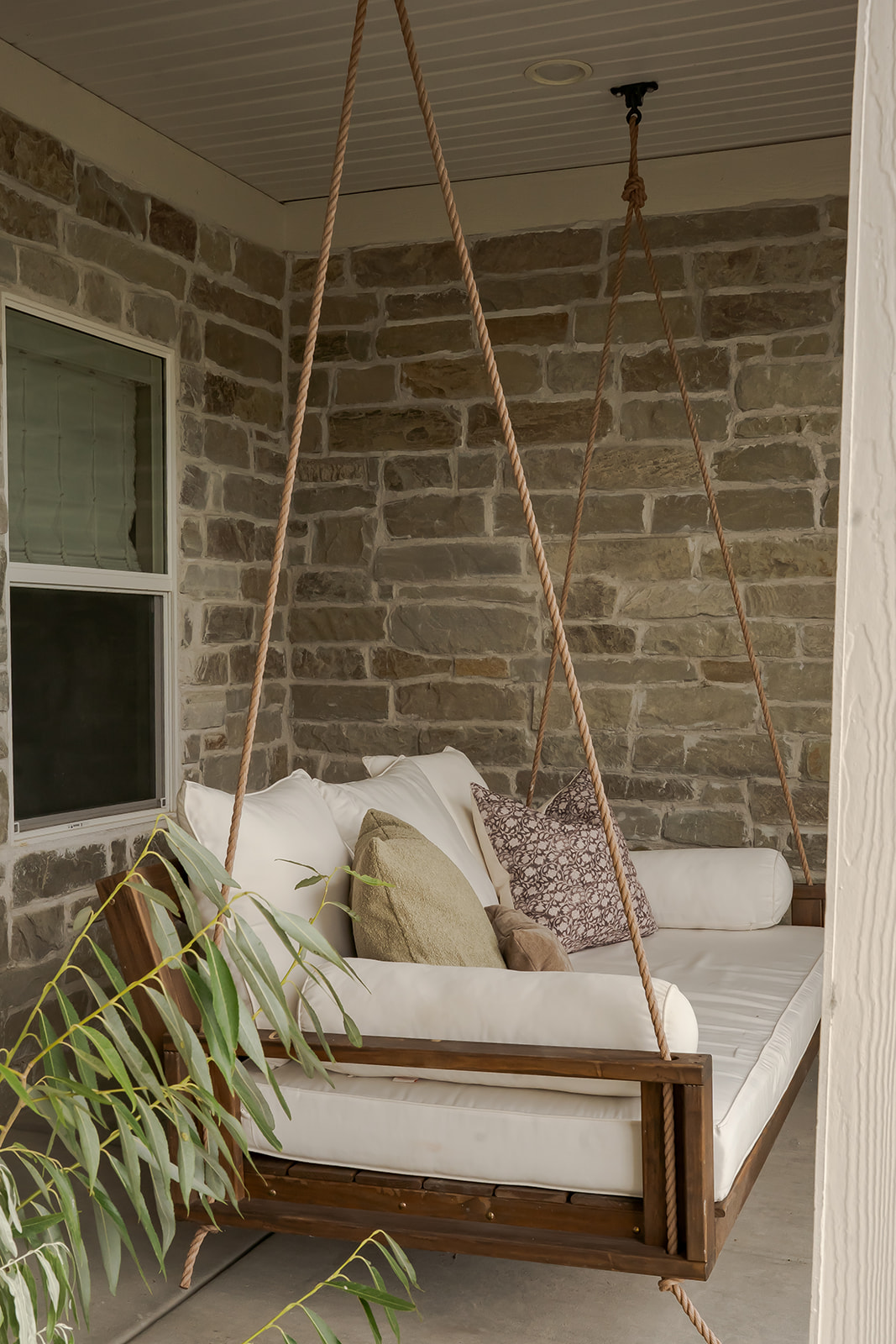 Porch swing with rope hangers